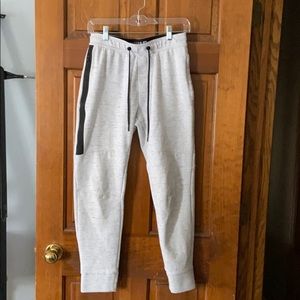 White and grey striped American eagle joggers